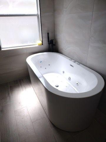 Warm Marble Retreat — Impretto Home bathroom remodeling project